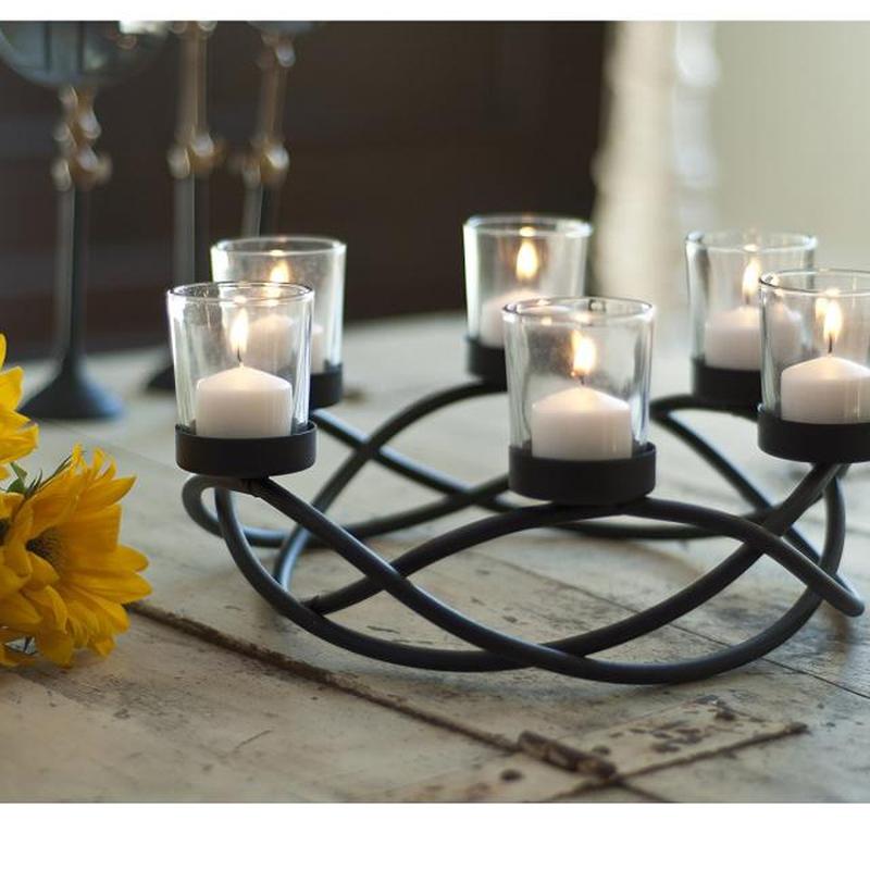 https://cf.ltkcdn.net/candles/images/slide/200586-850x850-Danya-B-Round-Waves-Candle-Holder.jpg