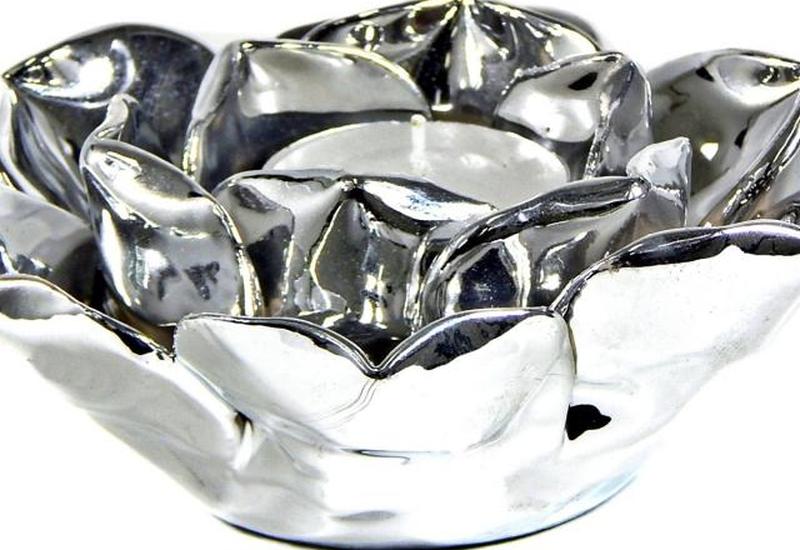 https://cf.ltkcdn.net/candles/images/slide/200593-850x584-Silver-Lotus-Votive-or-Tealight-holder.jpg