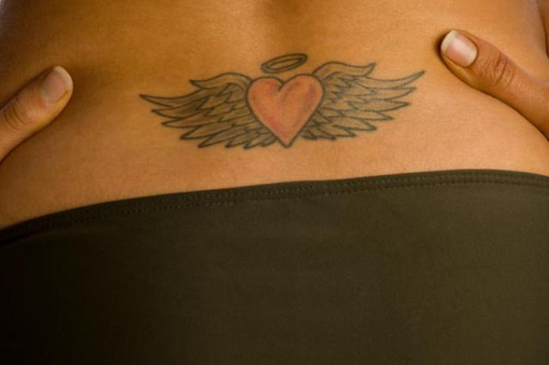 https://cf.ltkcdn.net/tattoos/images/slide/158356-849x565r1-Lower-back-tat.jpg